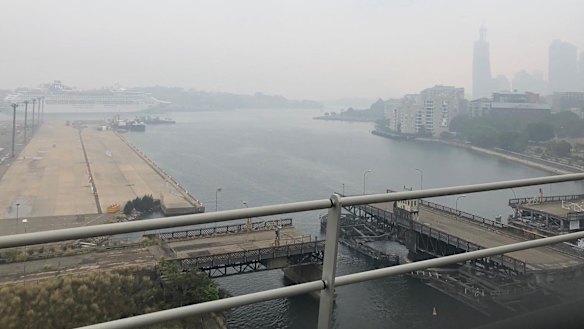 Sydney skyline is barely visible through the smoke haze.