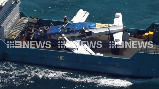 The plane is recovered from the water.