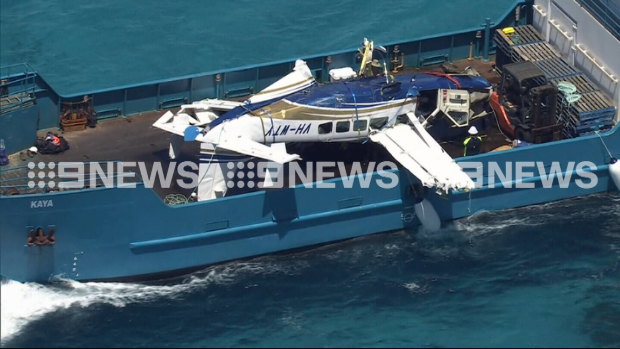 Plane wreckage from the downed Cessna off the coast of Rottnest Island is retrieved by investigators on Thursday.