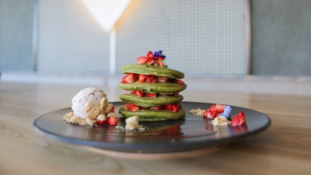 An Instagram friendly matcha pancake stack with chocolate sauce at Matcha Mylkbar.