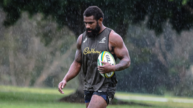 Marika Koroibete braves wet conditions at Wallabies training on Saturday at Sanctuary Cove. 
