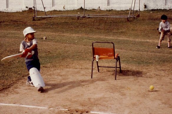 Usman Khawaja (left) as a small child playing in Pakistan, with a thigh pad covering a leg.