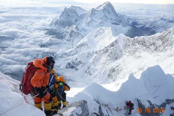 Among the highest people on Earth: atop Mount Everest.