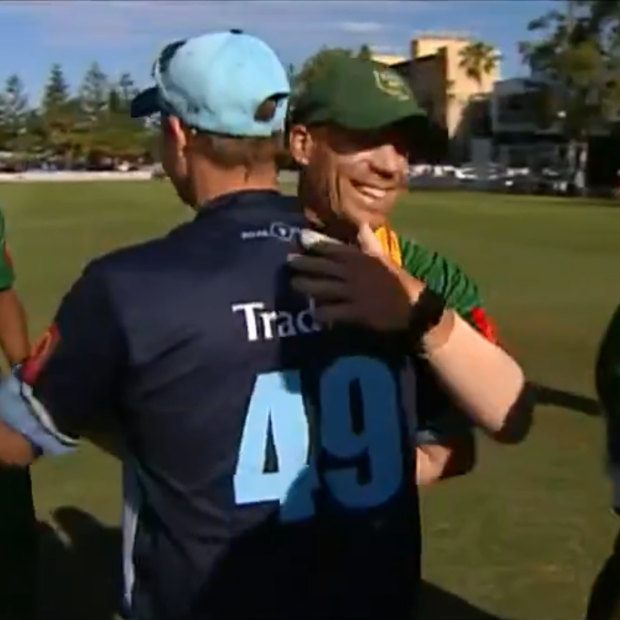 Smith and David Warner embrace after a match between Sutherland and Randwick Petersham in the summer.