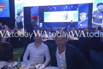 Hayden Burbank and Mark Babbage at the grand final eve luncheon at Perth Crown, attended by 1000 guests, including Gill McLachan (in background). 
