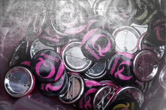 Q buttons for sale at a gathering of coronavirus sceptics on the eve of a planned protest march on August 28 in Berlin.