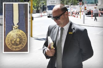 Barry Urban and the police medal that triggered investigations into his past.