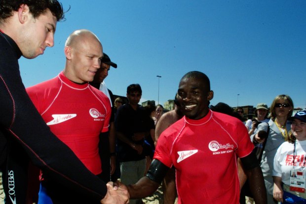 Grant Hackett and Michael Klim meet  Moussambani at Bondi. 