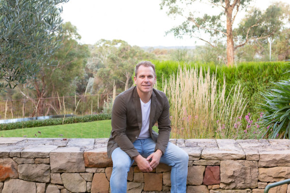 Landscape architect Nathan Burkett, with wife Kristen, bought the single-level house on a sloping block in 2010.