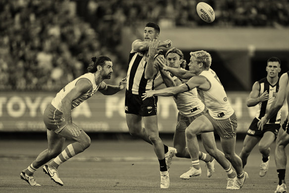 Pendlebury passes as opponents lunge in a round one match against the Sydney Swans in March, 2024.