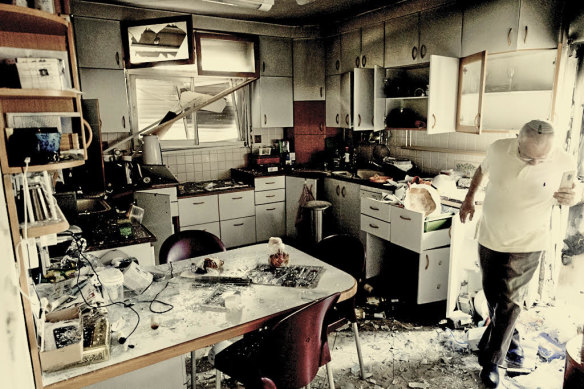 In Moreshet in Israel, a man inspects damage to his kitchen from a rocket fired from Lebanon on September 22. 