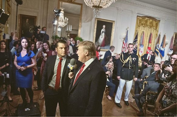 Hegseth interviews Donald Trump at a war veterans’ event in the White House for TV show Fox & Friends in 2017. 