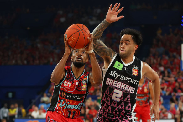 Bryce Cotton of the Wildcats is fouled by Izayah Le’afa of the Breakers driving to the basket during the round 15 NBL match.