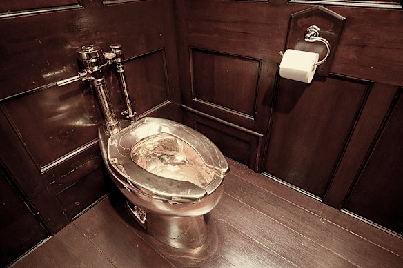 Artists Maurizio Cattelan’s solid gold toilet, which was later stolen from Blenheim Palace in 2019.