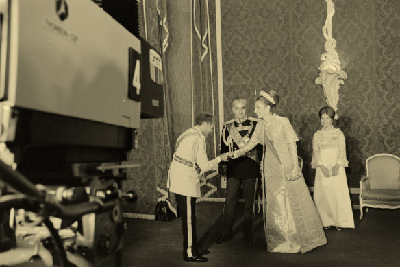 The Shah and Empress greet guests to their party in Persepolis in 1971.