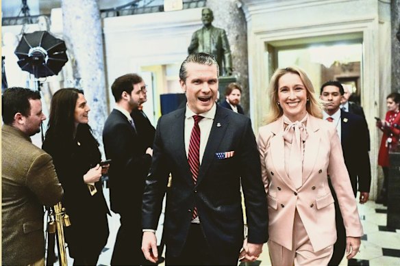 Hegseth and his wife, Jennifer Rauchet, arrive in Statuary Hall ahead of a joint session of Congress on March 4, 2025.