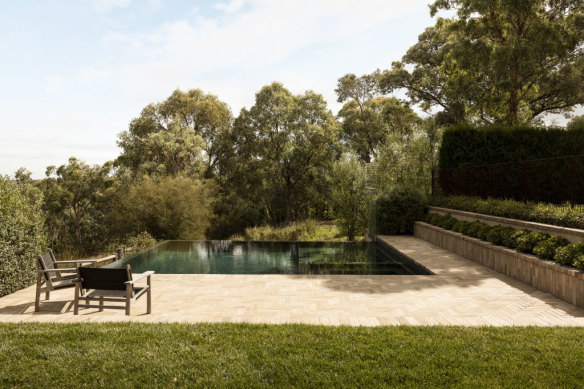 The sloping land means the pool has views over the treetops.