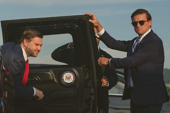 JD Vance (left) arrives to board Air Force Two at a Swiss air base after peace talks with Iran at the Lake Lucerne Summit. 