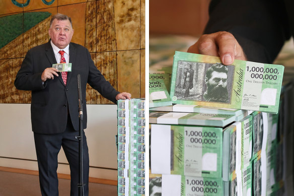 Craig Kelly with his “Ned Kelly” $1 trillion notes, printed at the taxpayers’ expense to illustrate that the taxpayer is being robbed.