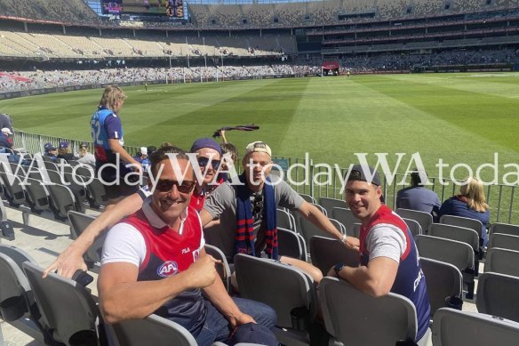 Hayden Burbank (front left) and Mark Babbage (back left) at the AFL grand final. 