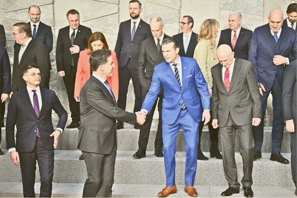 NATO Secretary General Mark Rutte shakes hands with Hegseth at the NATO Defence Ministers’ meeting in Brussels in February 2025.