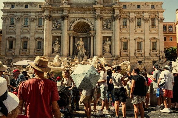 Tourists at the Trevi Fountain in Rome in July 2024.