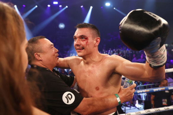 Tim Tszyu celebrates with his trainer after defeating Dennis Hogan in Newcastle.