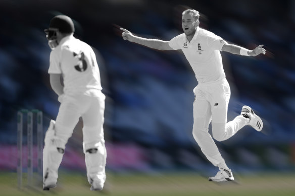 Stuart Broad celebrates snaring David Warner’s wicket.