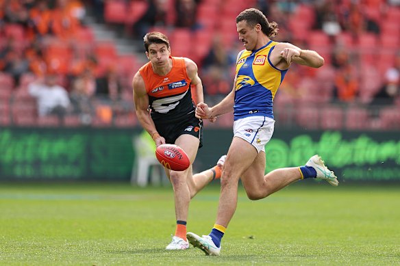 Jake Waterman kicks a goal against the Giants on Sunday.
