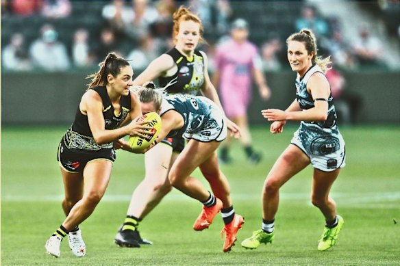 Monique Conti, at left, in 2021 is known for her explosive speed. 