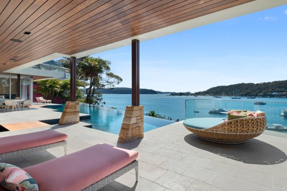 The three-level house is set on a waterfront parcel of 1600 square metres.