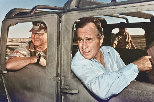 US president George H.W. Bush and General Norman Schwarzkopf visit troops during the Gulf War in 1990. 
