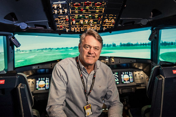 Former pilot David Evans in a flight simulator. 