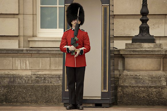 A Grenadier Guard outside Buckingham Palace. The guards shift their body weight ever so slightly from time to time to stay perfectly upright. 