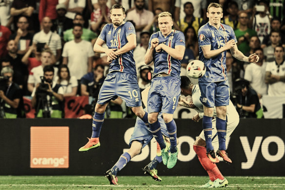 Players for Iceland block a ball in their European Championships match against England in 2016.