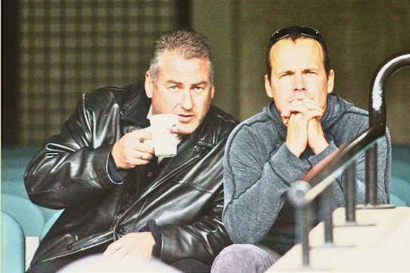 Back in 2003, Scott Clayton watches the play with Bulldogs then-assistant coach Chris Bond.