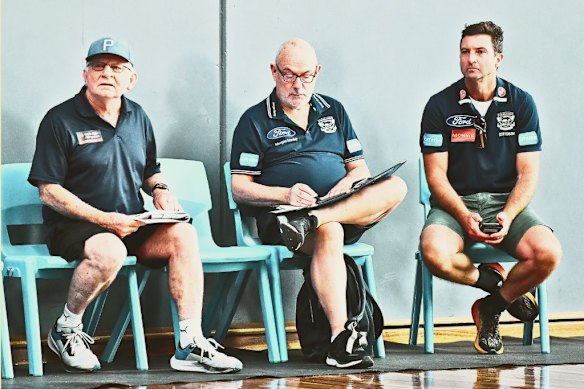 Talent expert Kevin Sheehan, left, and Shane O’Bree, far right, watch a boys’ ALF talent league game in 2023. O’Bree is now recruiting manager at Collingwood.  