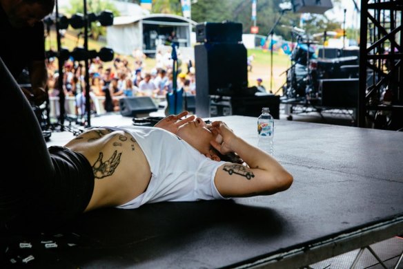 Maq onstage with Camp Cope at Laneway 2017.