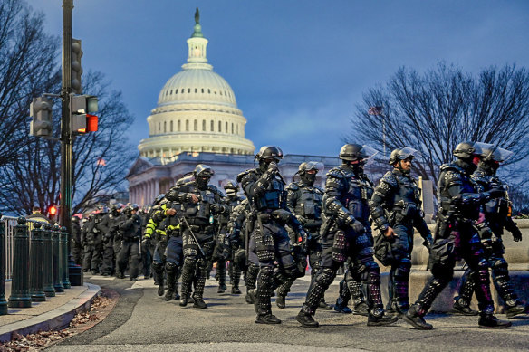 Police gather as protesters descend on the Capitol in Washington in 2021. 