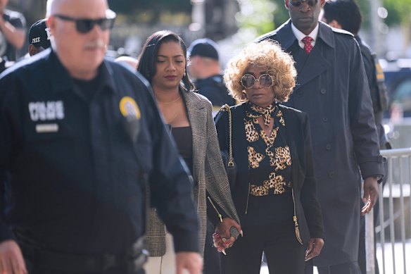 Janice Combs, mother of Sean “Diddy” Combs, centre right, arrives at the courthouse in New York.