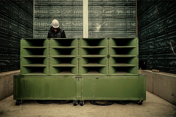 A worker dismantles loudspeakers set up for propaganda broadcasts near the DMZ in 2018. They’re now being dusted off for use again.