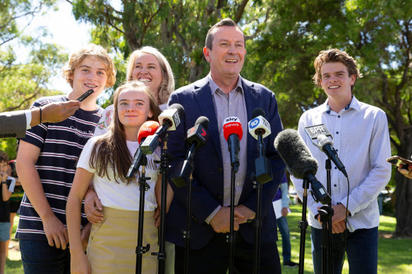 Premier Mark McGowan, surrounded by his wife and children, speaks to the media in 2021 after his landslide election win. 