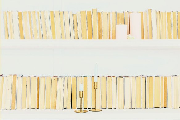 Spines facing to the wall is a radical minimal approach but good luck finding the titles when you need them.