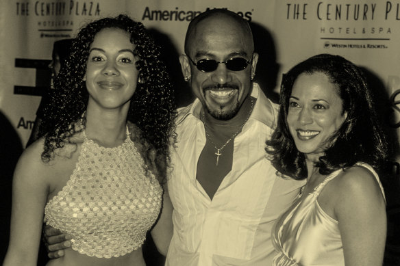 Harris poses with talk show host and actor Montel Williams, who she briefly dated, and his daughter, in 2001.