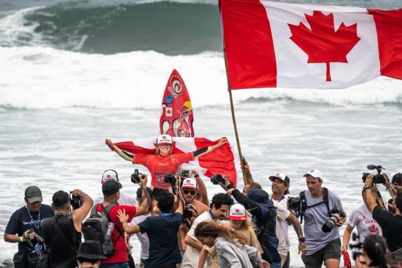 Brooks celebrates becoming Canada’s first junior surfing champion in El Salvador, 2022