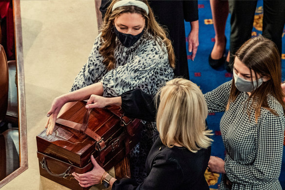 Aides arrive with ballot boxes for the joint session of Congress to certify electoral college votes on January 6, 2021.