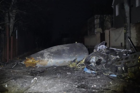 The remains of a Ukrainian jet shot down by the Russians, seen in the ruins of a two-story house in Kyiv. 