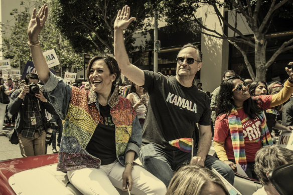 Harris, then a senator and a presidential candidate, with husband Doug Emhoff, during a Pride parade in San Francisco in 2019.