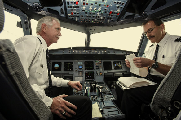 Captain Chesley “Sully” Sullenberger, left, and first officer Jeffrey Skiles go through their pre-flight checks at LaGuardia airport in New York in 2009.