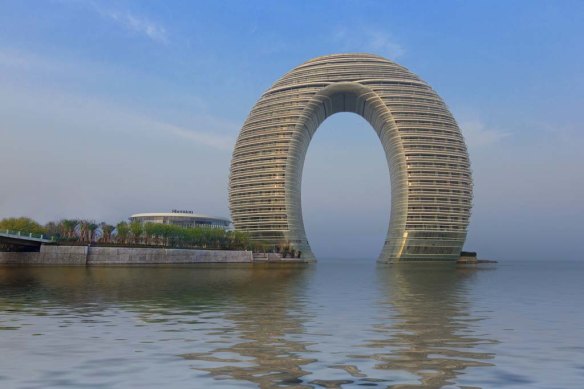 The Sheraton Huzhou Hot Spring Resort on China’s Lake Taihu has features including a “wedding island”. The architects may not appreciate the description, but the 321-room hotel looks a bit like a squished donut.
